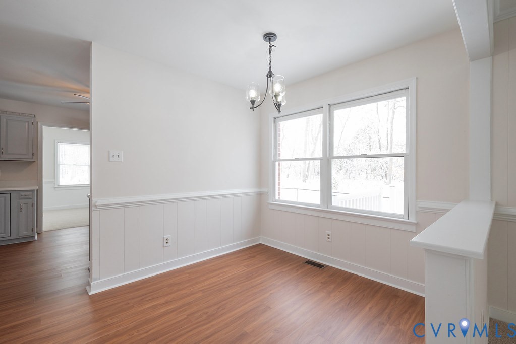 10510 Courtney Road Glen Allen, VA 23060 - Photo 16 of 44 an empty room with wooden floor and windows