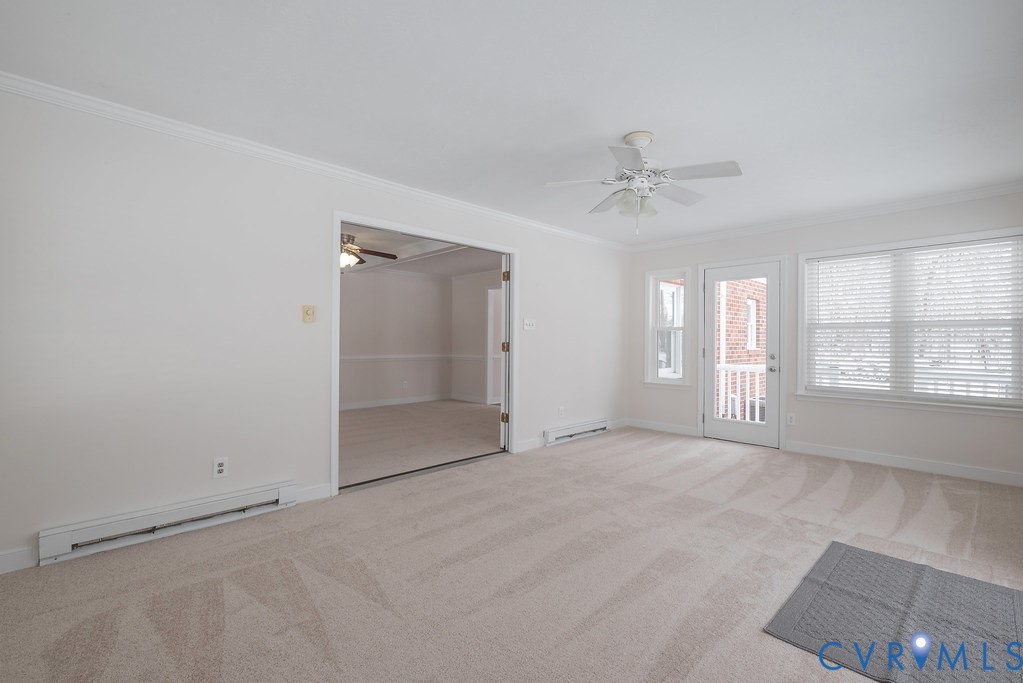 10510 Courtney Road Glen Allen, VA 23060 - Photo 23 of 44 an empty room with windows and cabinet