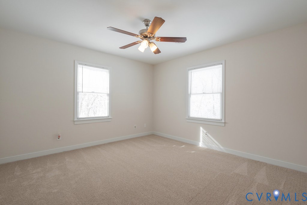 10510 Courtney Road Glen Allen, VA 23060 - Photo 24 of 44 an empty room with windows and fan