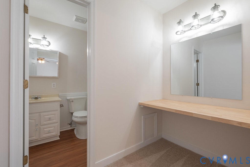 10510 Courtney Road Glen Allen, VA 23060 - Photo 35 of 44 a bathroom with a toilet sink and a mirror