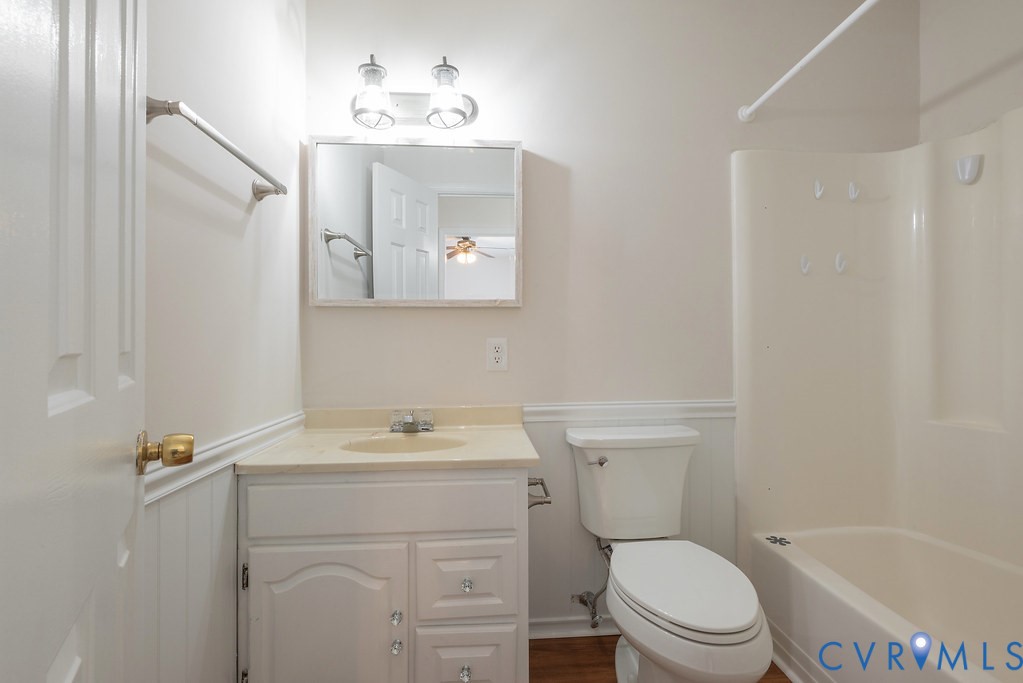10510 Courtney Road Glen Allen, VA 23060 - Photo 36 of 44 a bathroom with a toilet a sink a bath tub and mirror