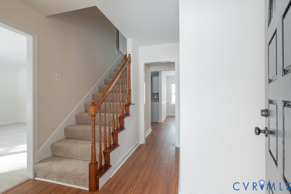 10510 Courtney Road Glen Allen, VA 23060 - Photo 4 of 44 a view of a hallway with wooden floor and staircase