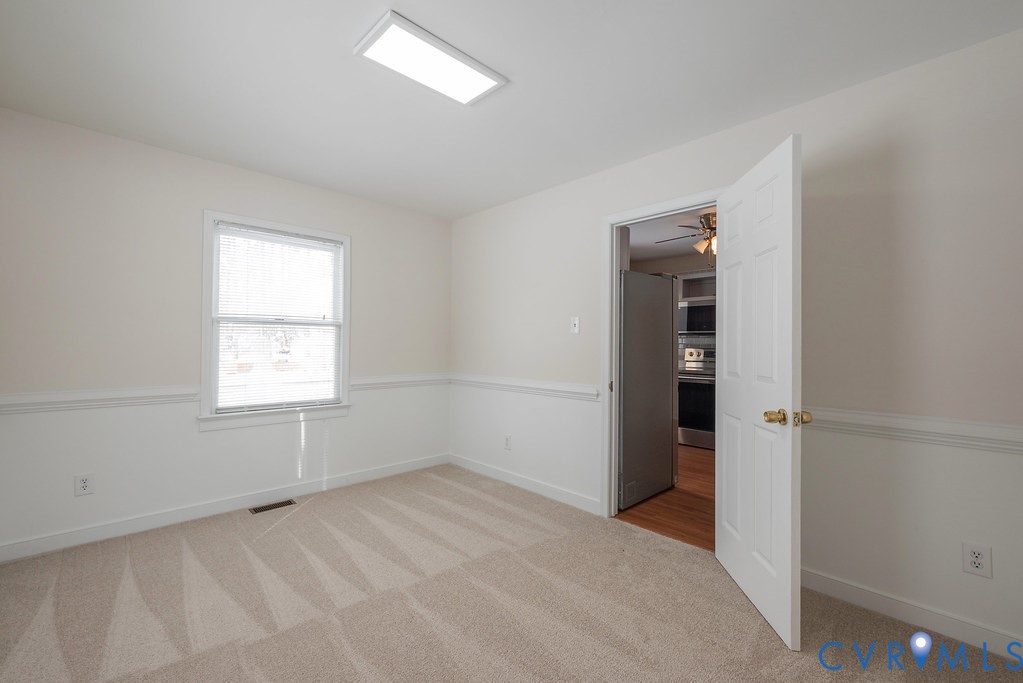 10510 Courtney Road Glen Allen, VA 23060 - Photo 8 of 44 an empty room with windows and closet