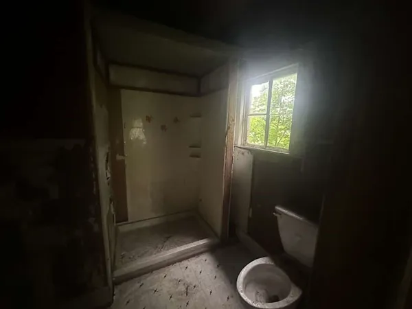 a bathroom with a toilet and a sink