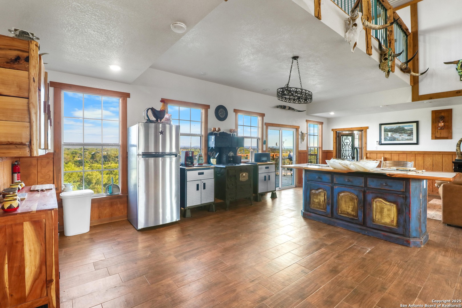 170 Teich Lane Bandera, TX 78003 - Photo 6 of 11 a open kitchen with stainless steel appliances granite countertop a stove and a wooden floors