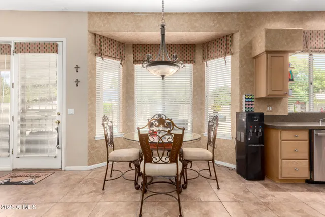 a view of a workspace with furniture and a flat screen tv