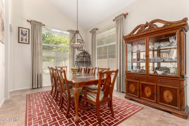 a kitchen with stainless steel appliances granite countertop a sink a stove and refrigerator