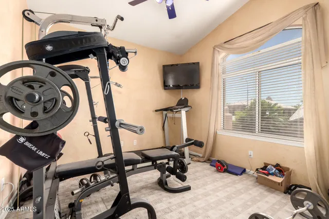 a living room with furniture a window and a rug