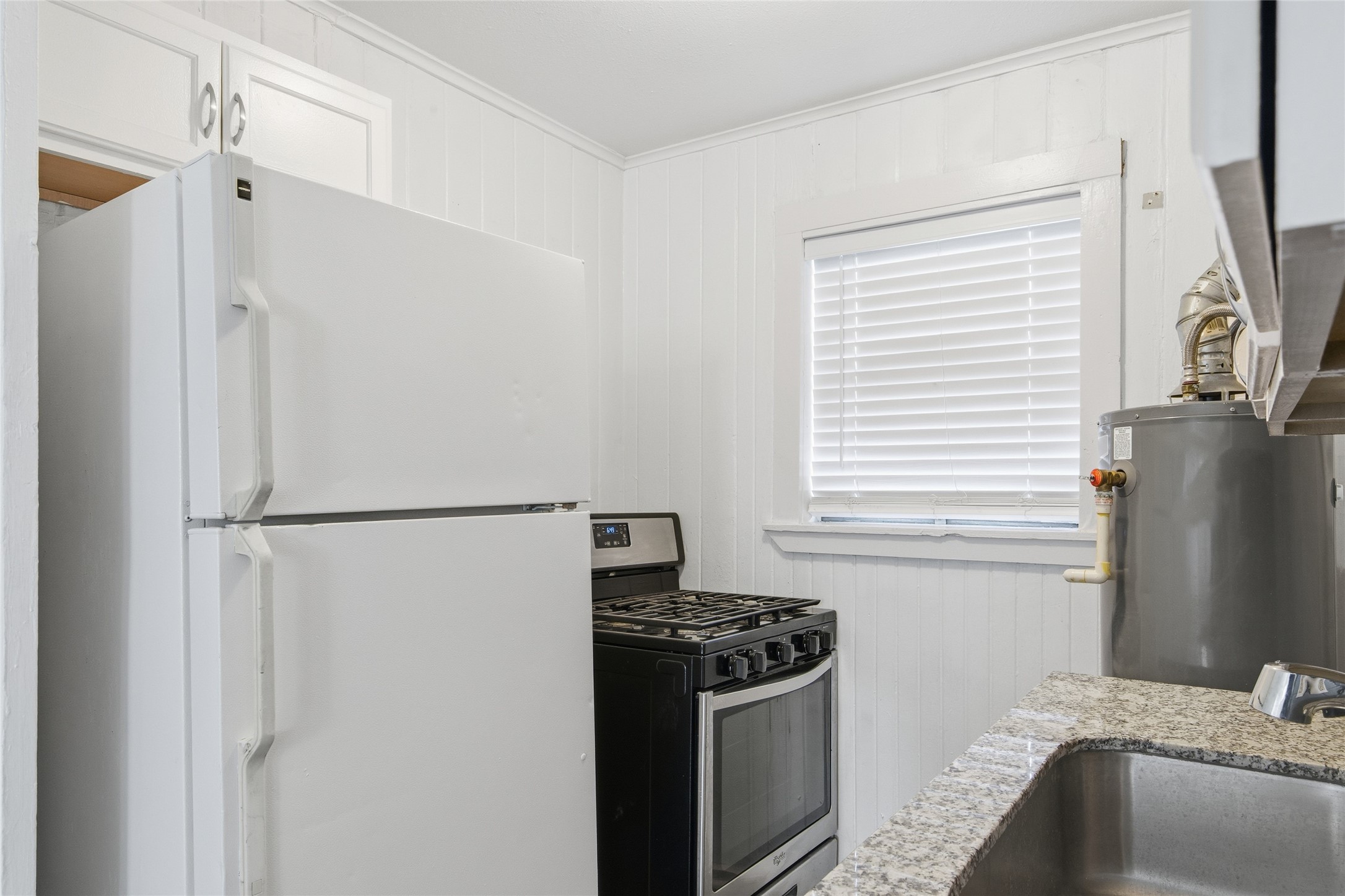 5010 Ennis Street, Unit 2 Houston, TX 77004 - Photo 6 of 11 a kitchen with a refrigerator stove and sink