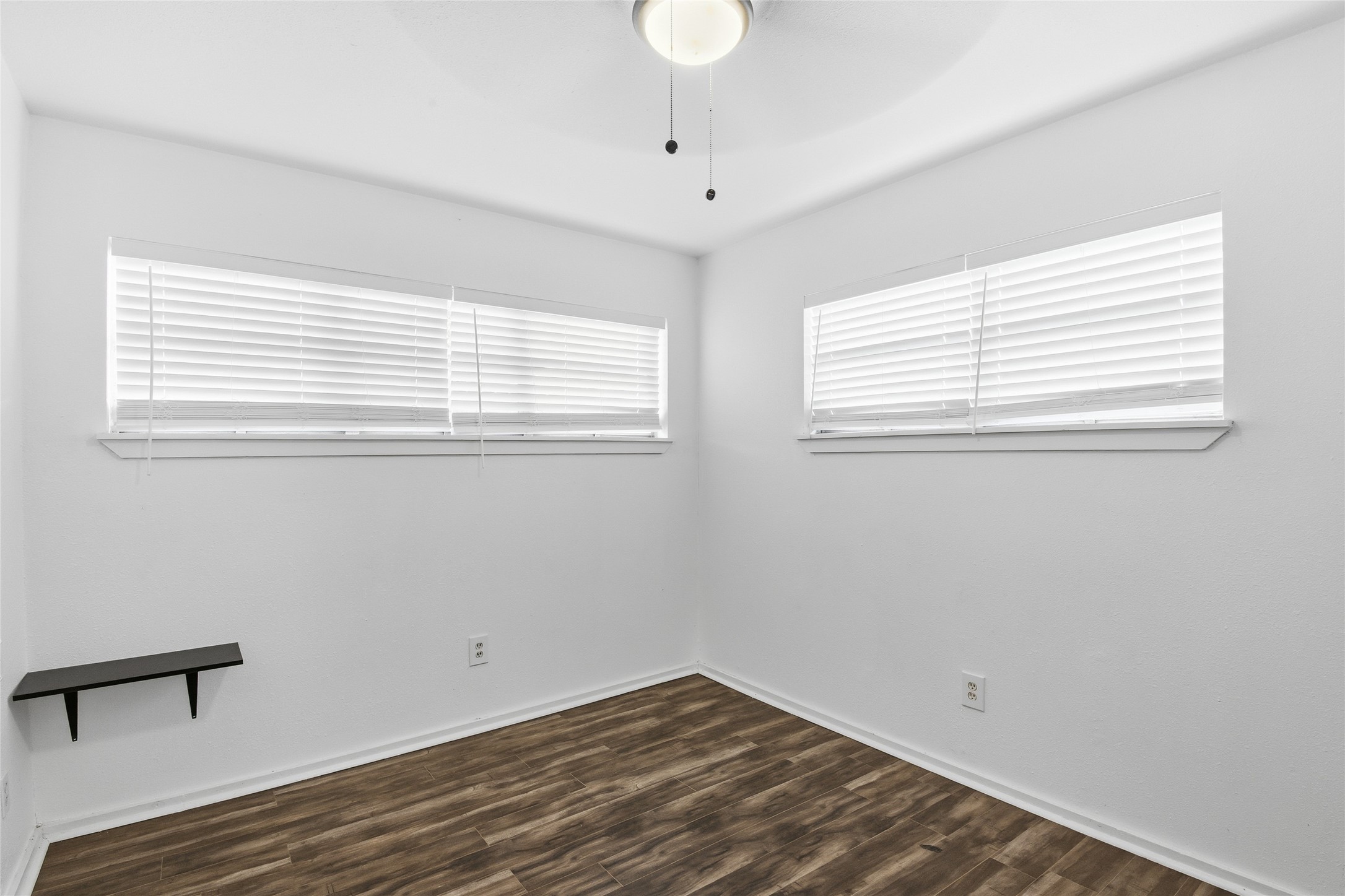 5010 Ennis Street, Unit 2 Houston, TX 77004 - Photo 9 of 11 a view of empty room with wooden floor and fan