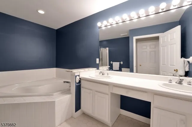 a bathroom with a sink double vanity and a mirror