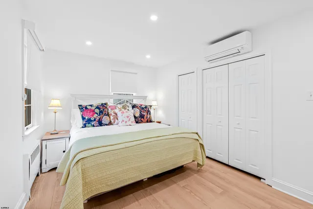 a bedroom with a bed and a closet