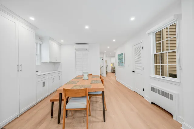 a dining room with a table and chairs