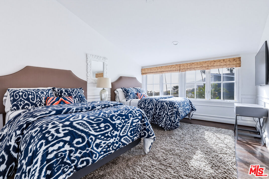 30810 Broad Beach Road Malibu, CA 90265 - Photo 43 of 55 a bed room with two beds and a large window