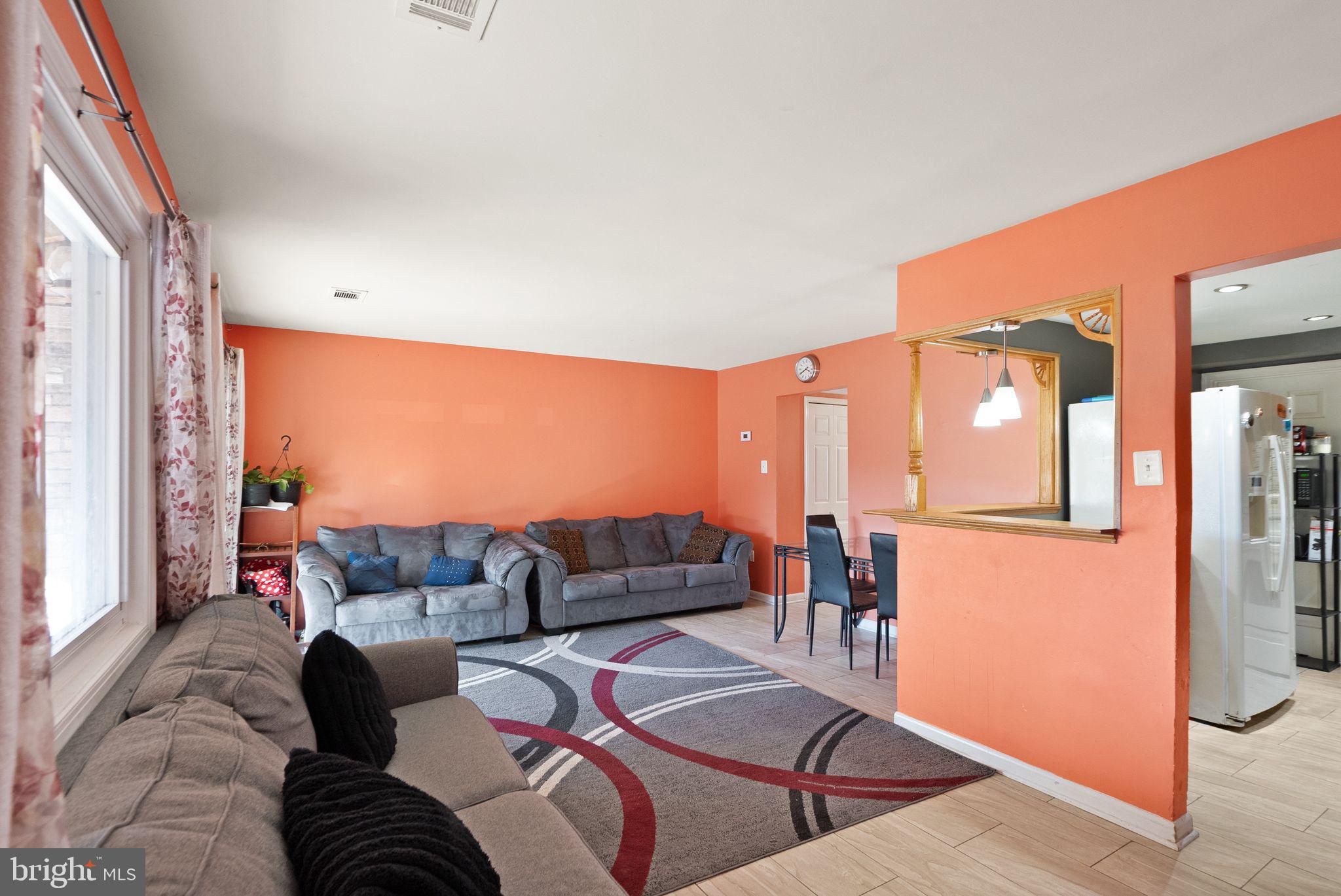 191 North Cottage Road Sterling, VA 20164 - Photo 11 of 41 a living room with furniture and a large window