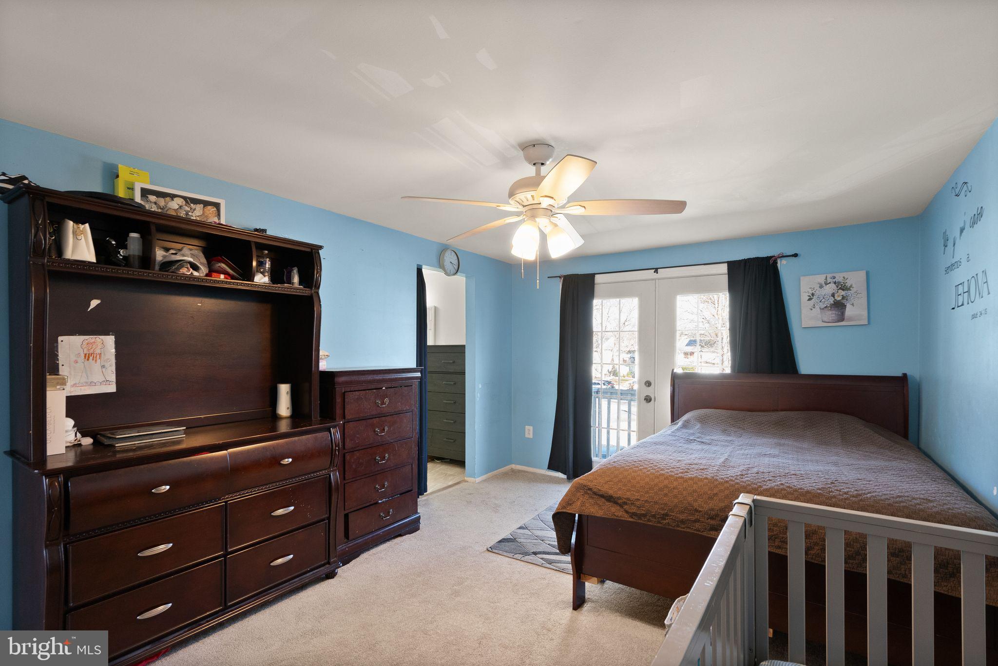 191 North Cottage Road Sterling, VA 20164 - Photo 16 of 41 a bedroom with a bed and a flat screen tv