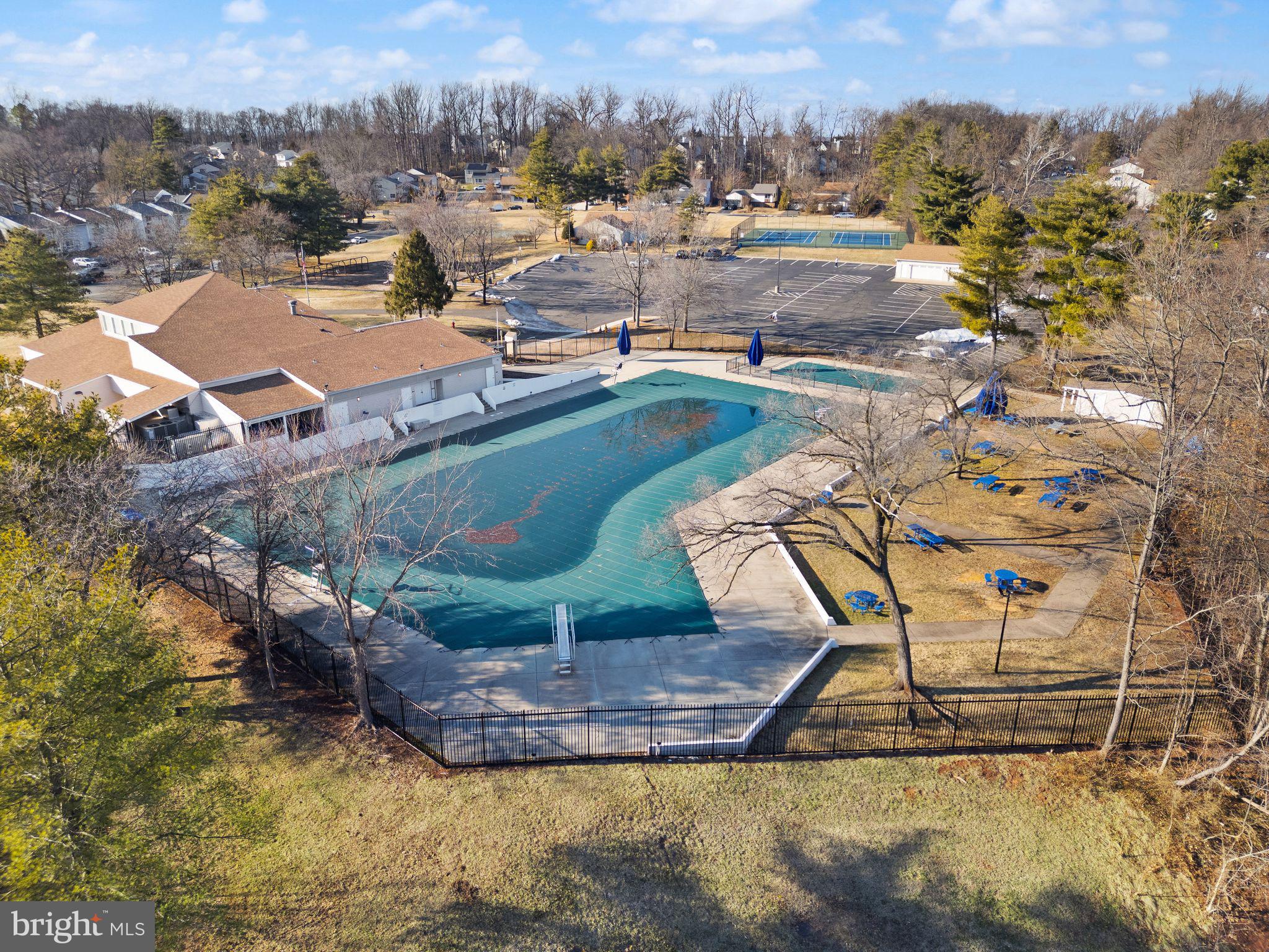 191 North Cottage Road Sterling, VA 20164 - Photo 32 of 41 a view of a swimming pool with outdoor seating and a mountain view in the back
