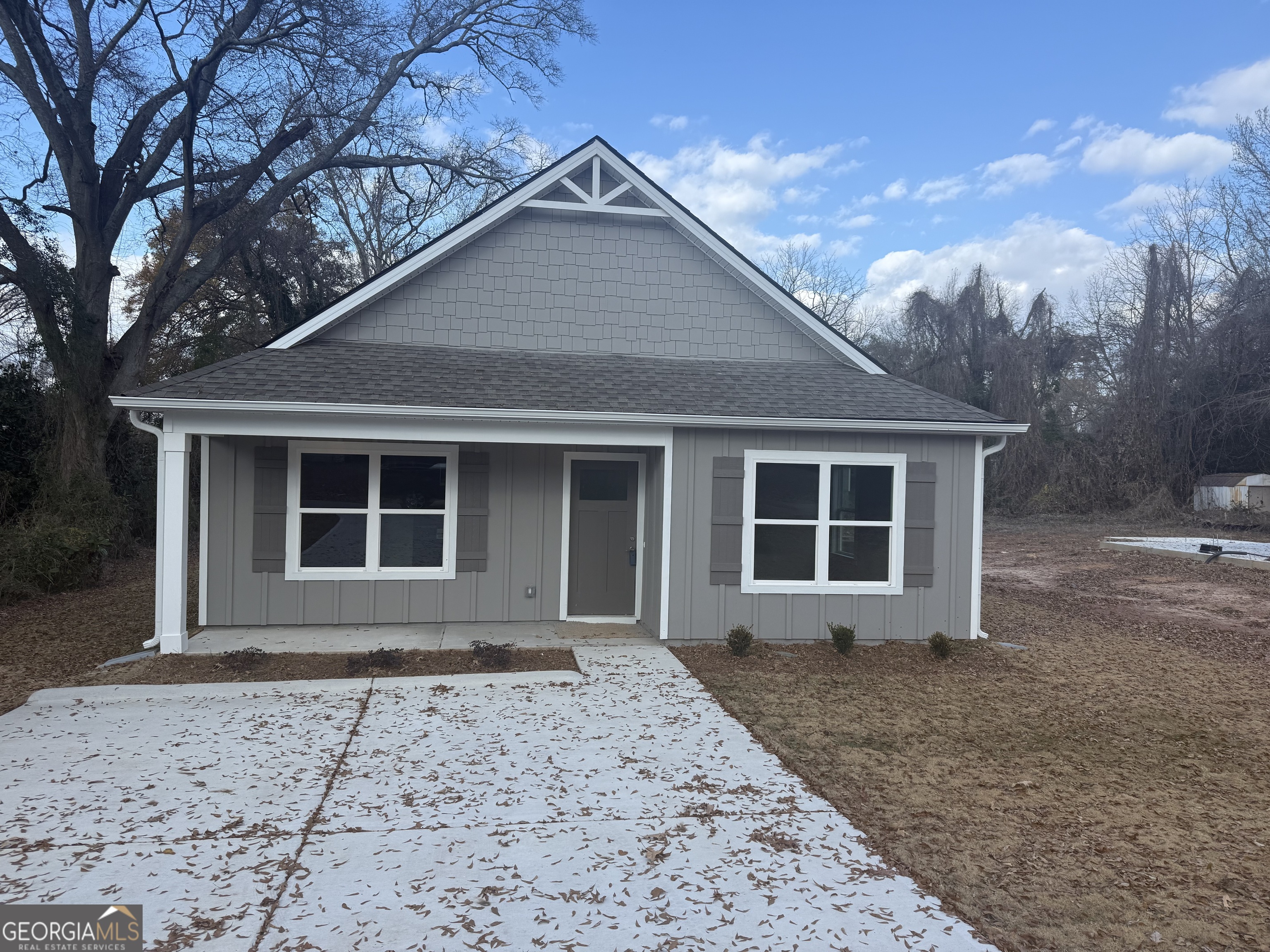 112 Cedar Street LaGrange, GA 30241 - Photo 1 of 2 a front view of a house with garden