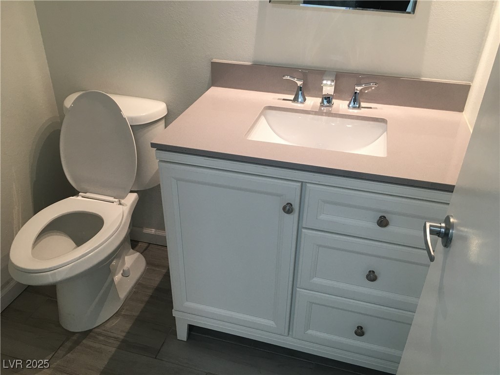 973 Cedar Pines Street Henderson, NV 89011 - Photo 15 of 37 Bathroom featuring vanity and a textured wall