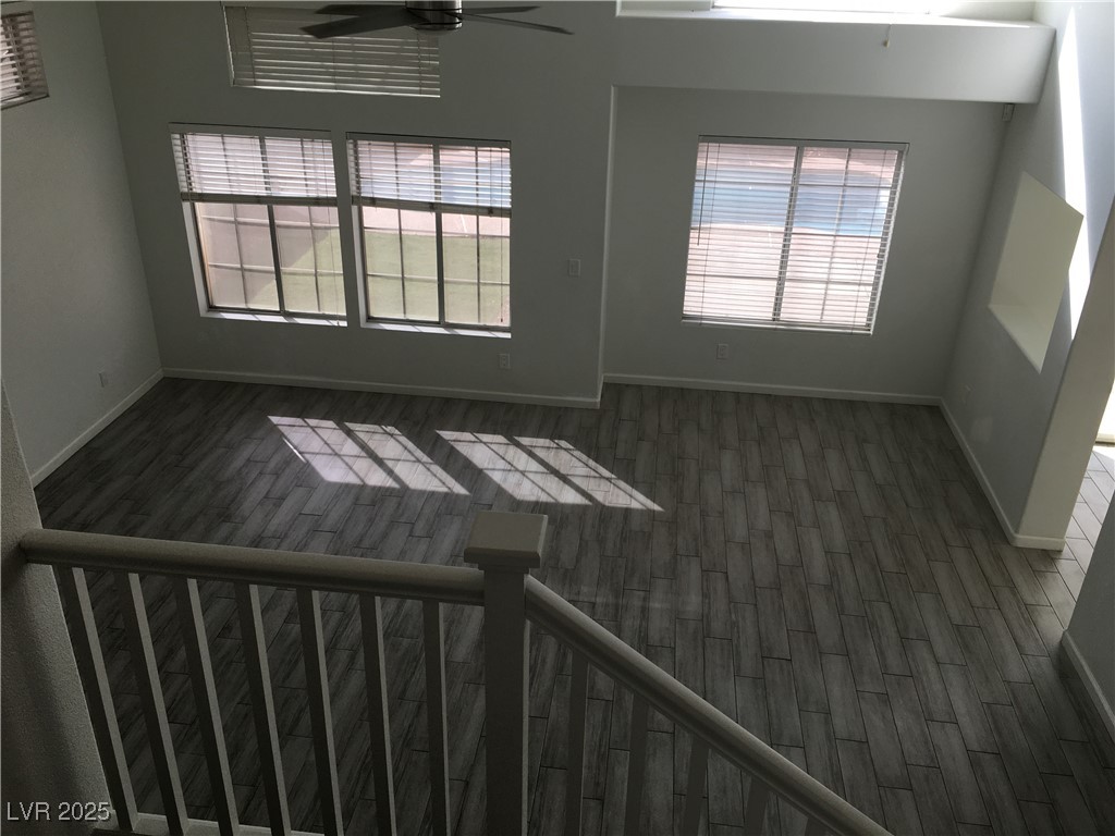 973 Cedar Pines Street Henderson, NV 89011 - Photo 18 of 37 Unfurnished room with dark wood-style flooring, plenty of natural light, and ceiling fan