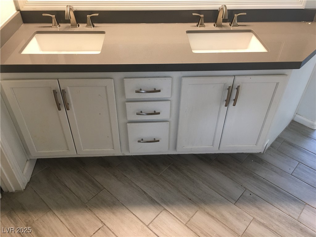973 Cedar Pines Street Henderson, NV 89011 - Photo 21 of 37 Full bath with wood tiled floors and double vanity