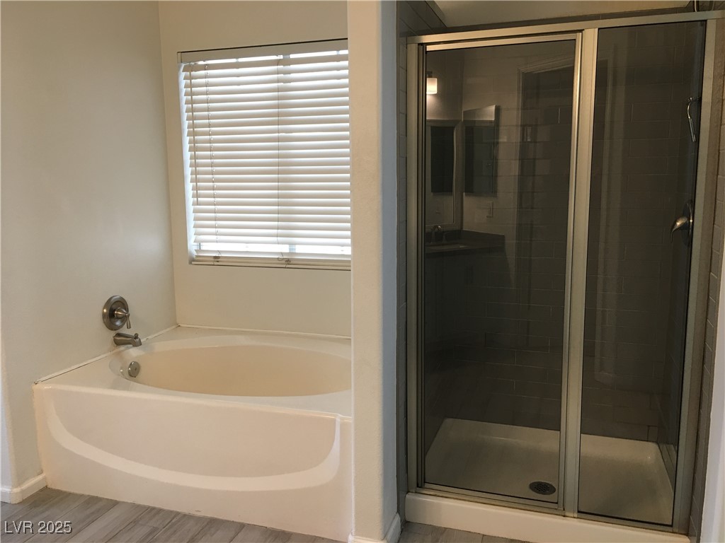 973 Cedar Pines Street Henderson, NV 89011 - Photo 22 of 37 Bathroom with a shower stall and a bath
