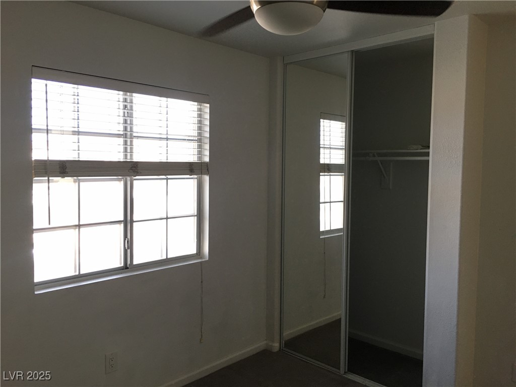 973 Cedar Pines Street Henderson, NV 89011 - Photo 27 of 37 Unfurnished bedroom featuring a closet and ceiling fan