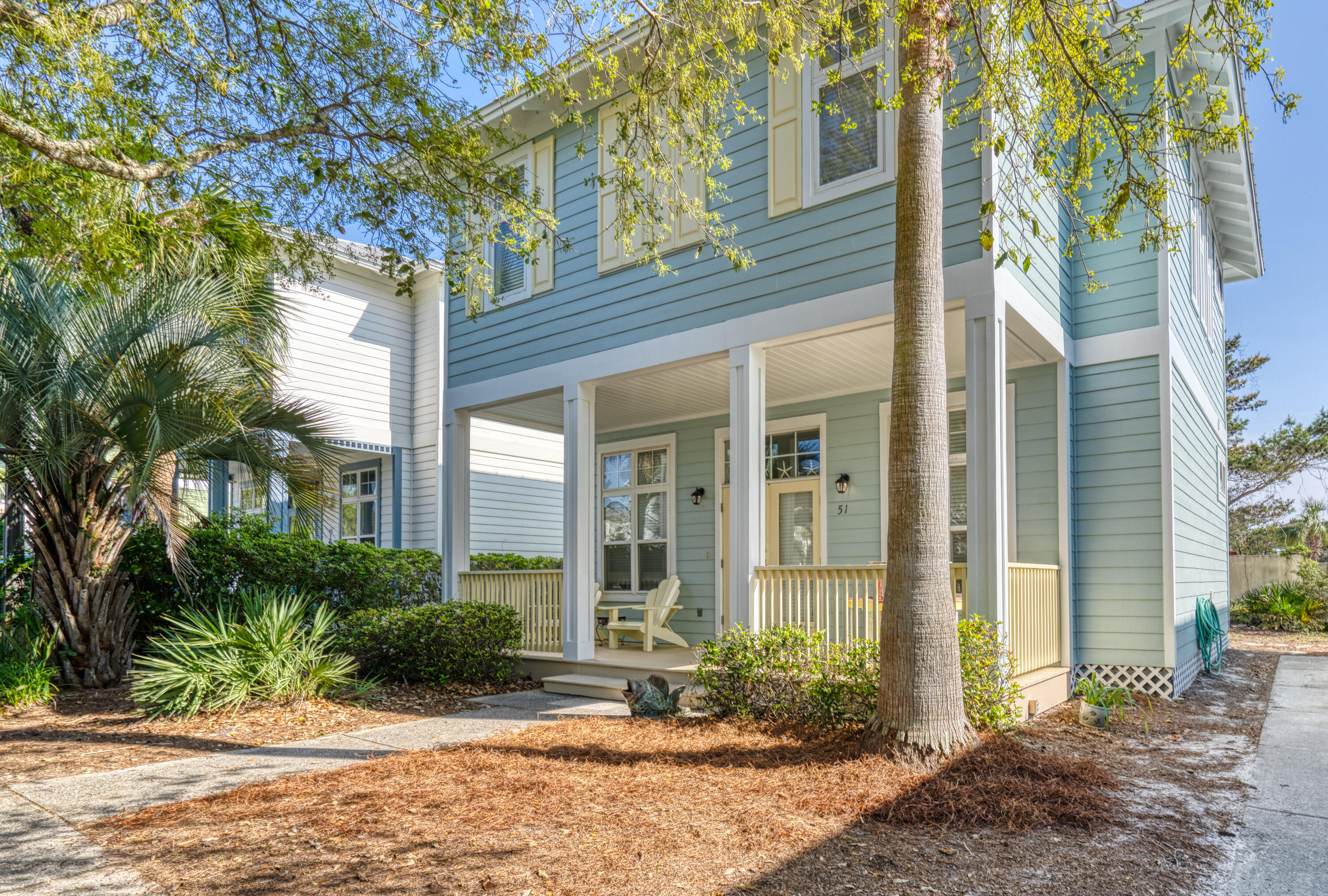 51 Redfish Circle Santa Rosa Beach, FL 32459 - Photo 1 of 17 a view of a brick house with a large windows and large trees