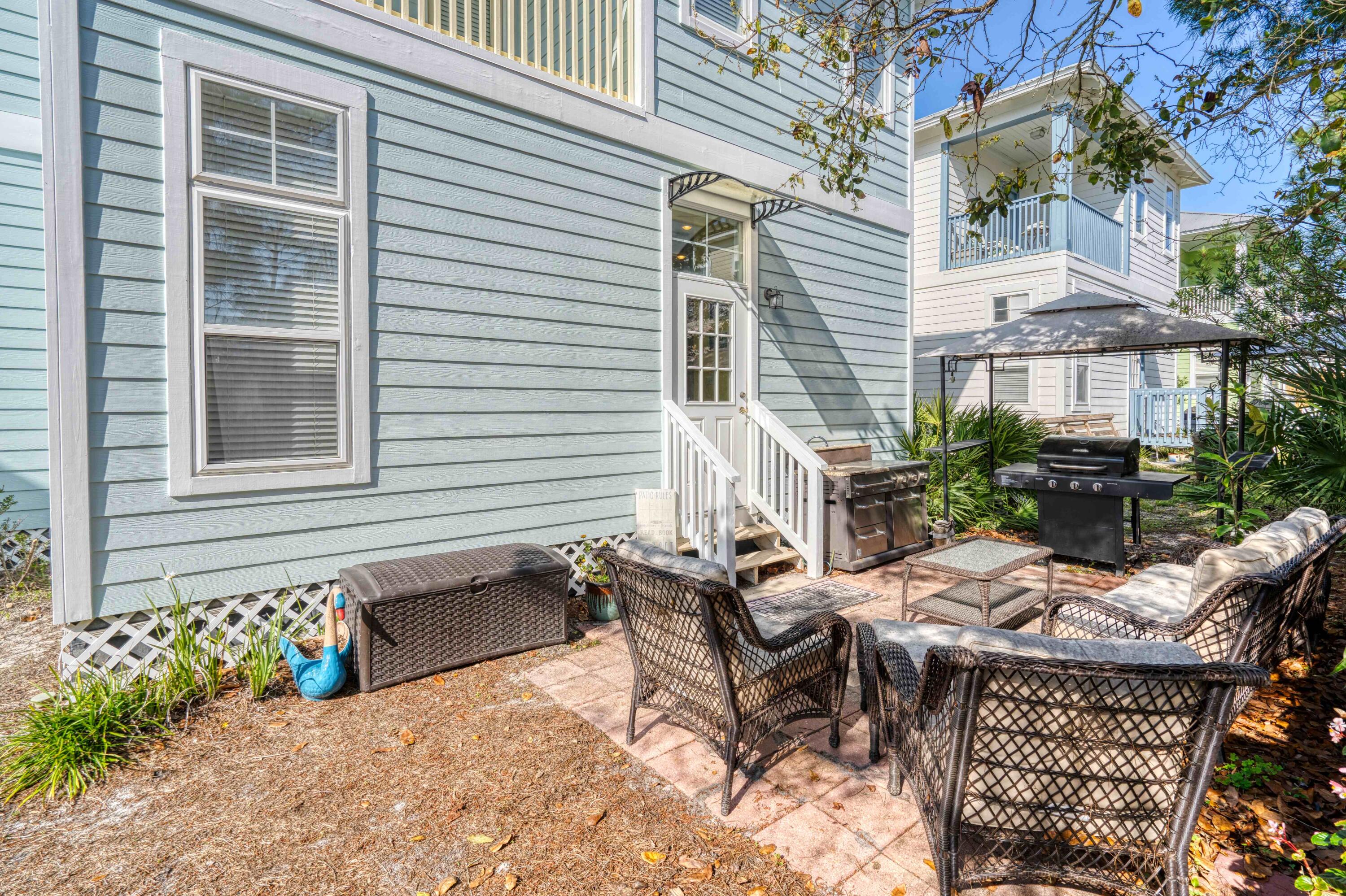 51 Redfish Circle Santa Rosa Beach, FL 32459 - Photo 16 of 17 a view of a house with backyard and sitting area
