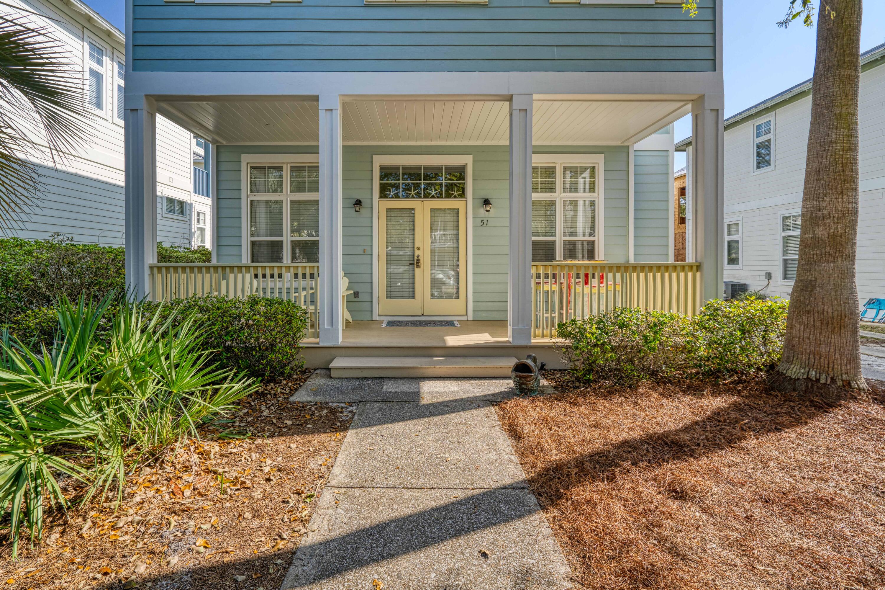 51 Redfish Circle Santa Rosa Beach, FL 32459 - Photo 2 of 17 a front view of a house having garden