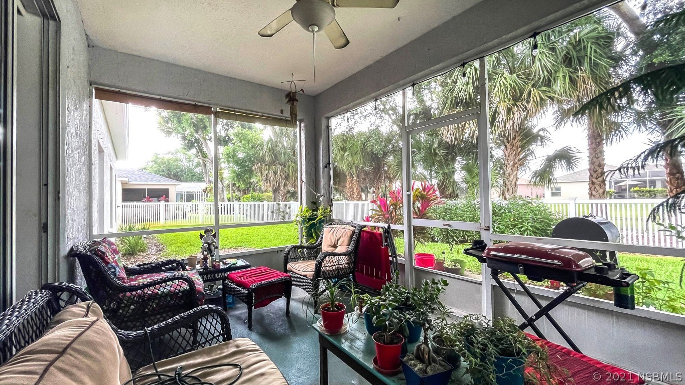 339 Mariners Gate Drive Edgewater, FL 32141 - Photo 13 of 30 a room with furniture and a potted plant