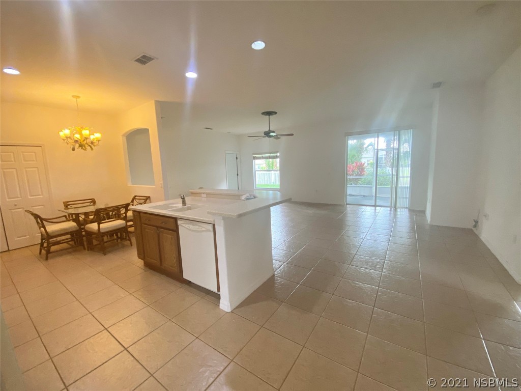 339 Mariners Gate Drive Edgewater, FL 32141 - Photo 14 of 30 a view of a kitchen with furniture and natural light