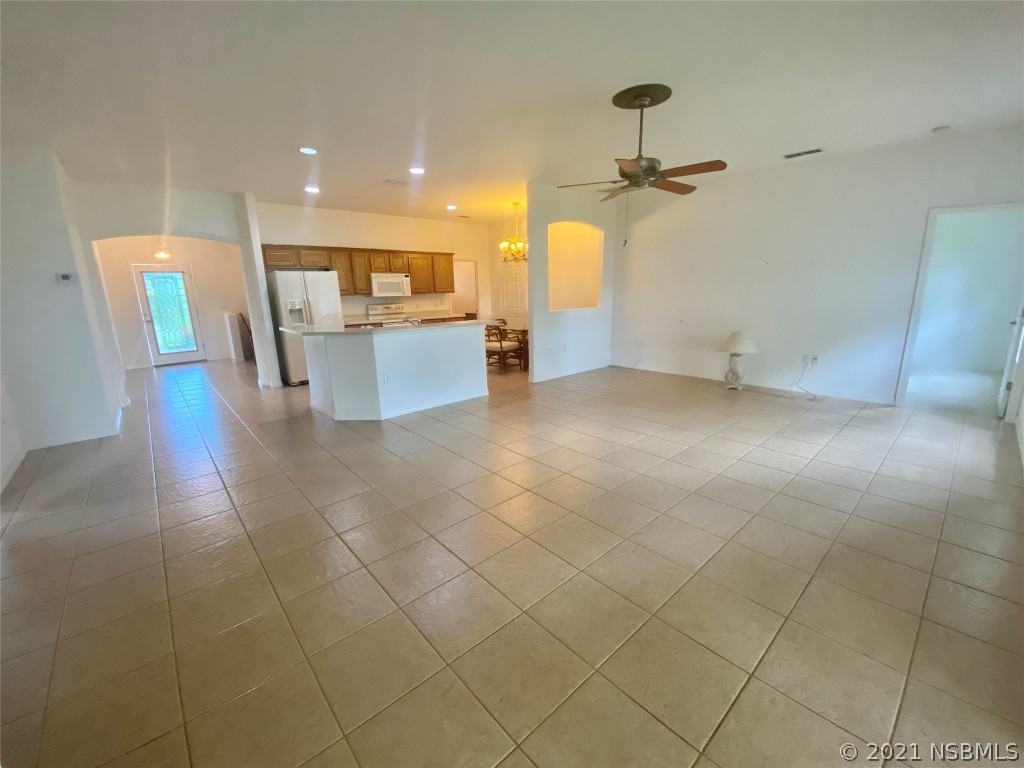 339 Mariners Gate Drive Edgewater, FL 32141 - Photo 15 of 30 a view of a kitchen and an empty room