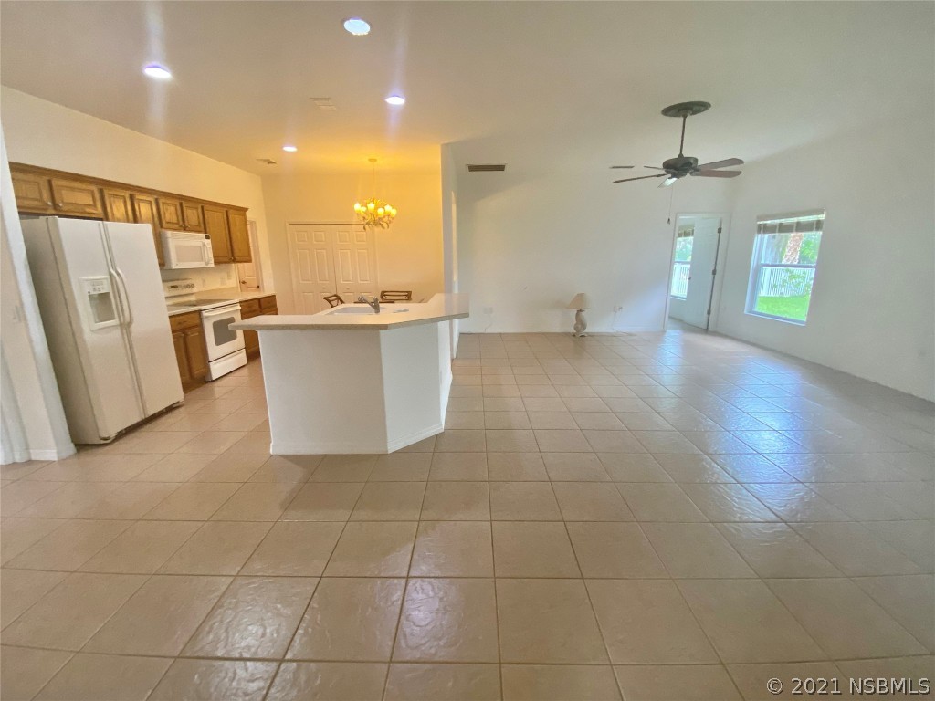 339 Mariners Gate Drive Edgewater, FL 32141 - Photo 16 of 30 a view of a kitchen with furniture and a window