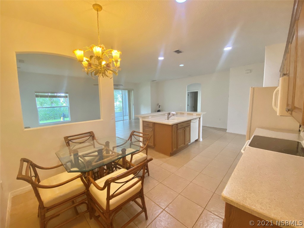 339 Mariners Gate Drive Edgewater, FL 32141 - Photo 18 of 30 a view of a livingroom with furniture and a chandelier
