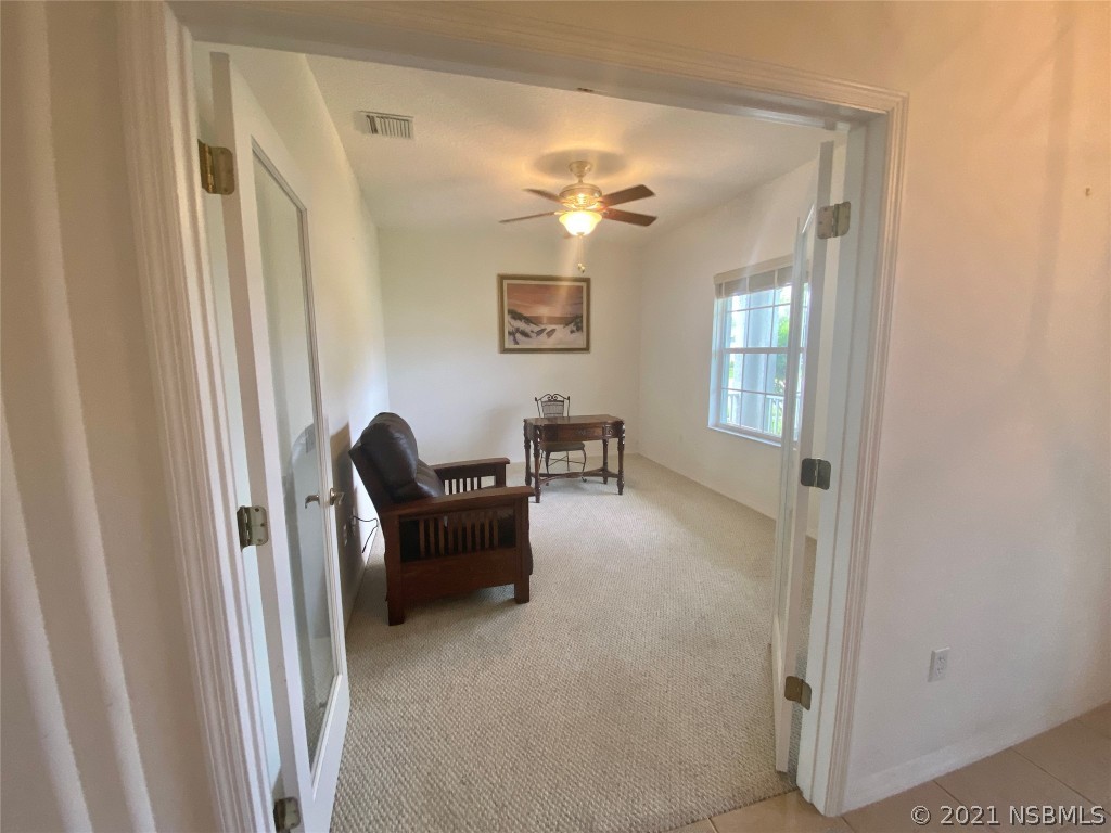 339 Mariners Gate Drive Edgewater, FL 32141 - Photo 21 of 30 a living room with furniture and a window