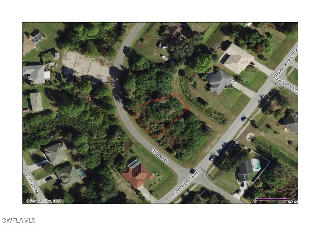 Embassy Rd Port North Port, FL 34291 - Photo 8 of 12 an aerial view of a house with a yard