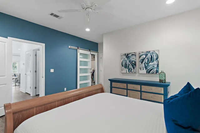 a bedroom with a bed and a dresser