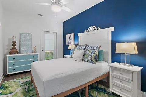 a bedroom with a bed and a dresser