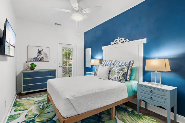 a bed room with a bed window and a television