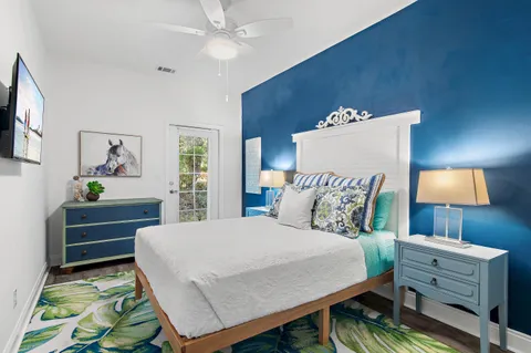 a bed room with a bed window and a television