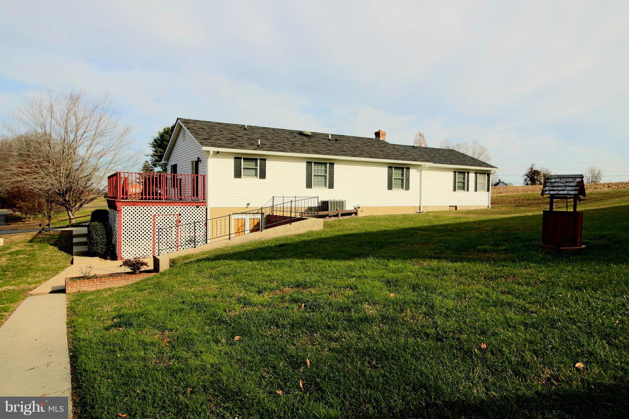 231 Deale Road Tracys Landing, MD 20779 - Photo 28 of 43 a front view of a house with a yard and trees