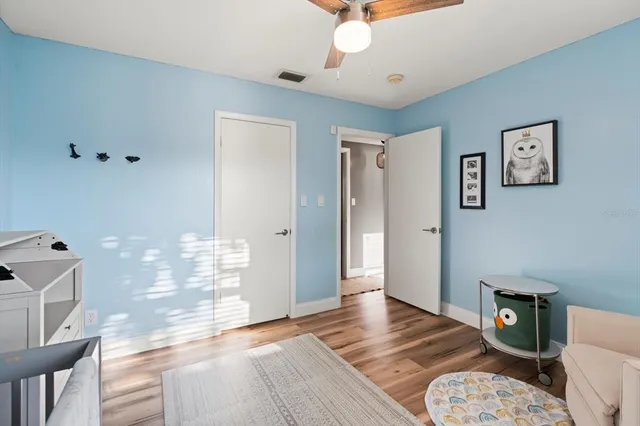 a bathroom with a sink a toilet a mirror and shower