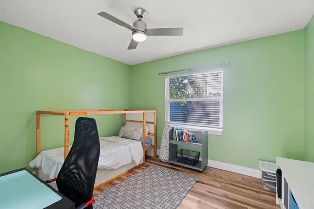 a view of a room with furniture and wooden floor