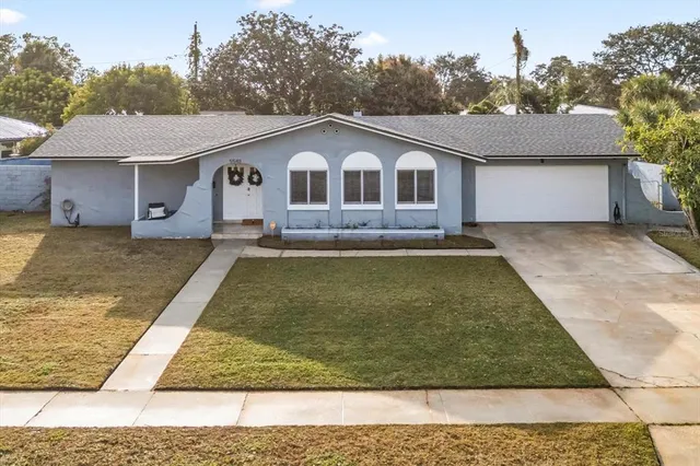 a front view of a house with yard