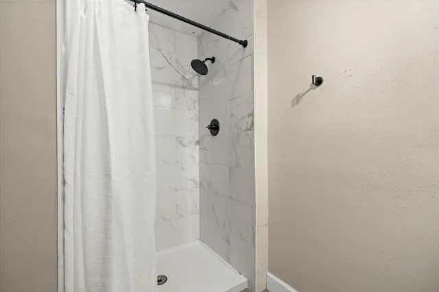 a living room with furniture pool table and rug