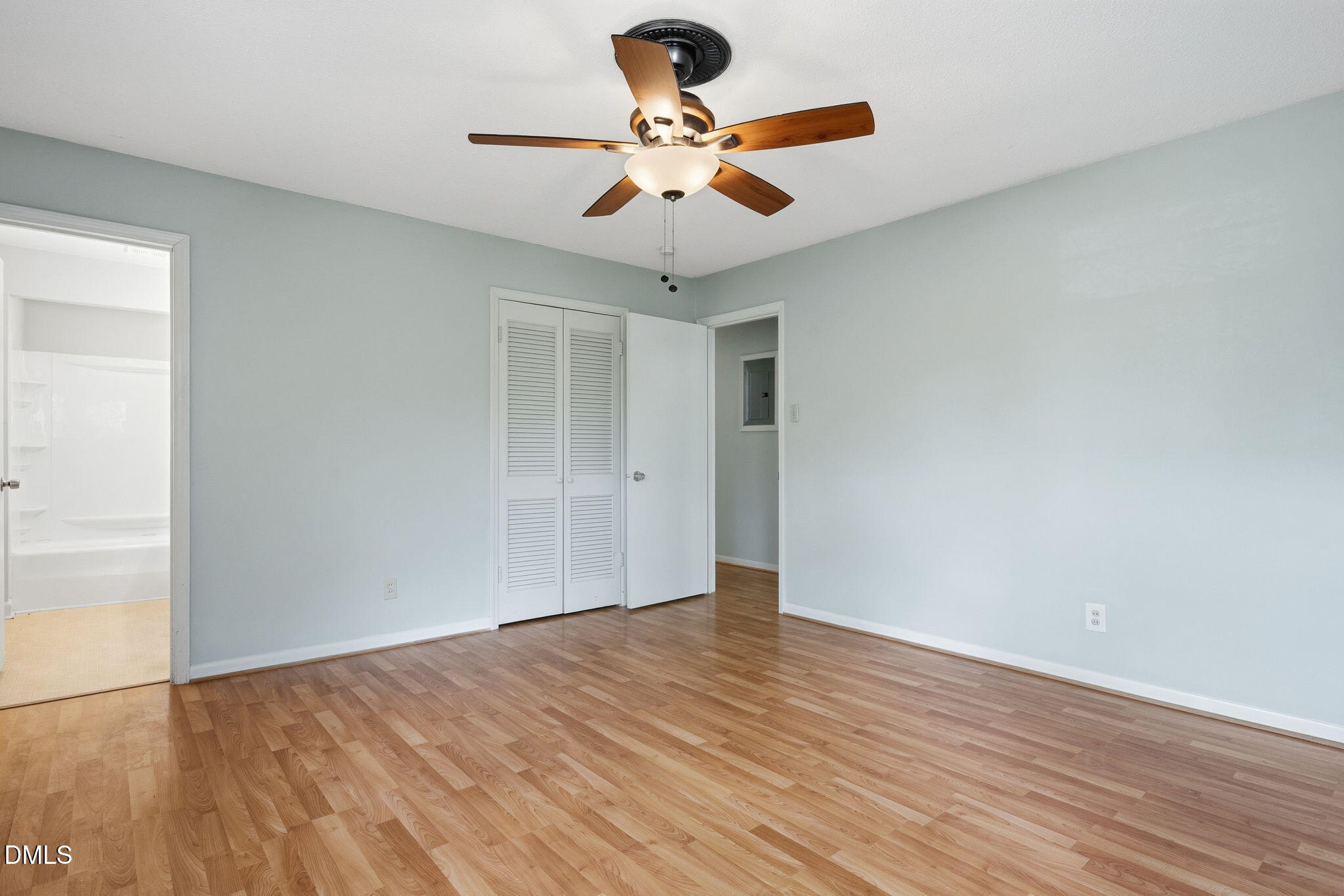 511 Hunter Street Durham, NC 27712 - Photo 13 of 30 a view of an empty room with window and wooden floor