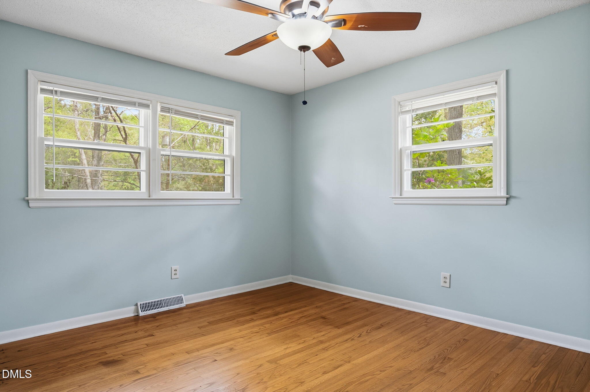 511 Hunter Street Durham, NC 27712 - Photo 14 of 30 a view of an empty room with wooden floor and a window