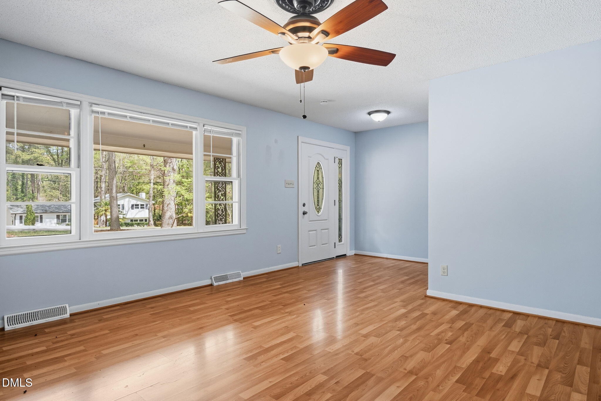 511 Hunter Street Durham, NC 27712 - Photo 2 of 30 wooden floor in an empty room with a window