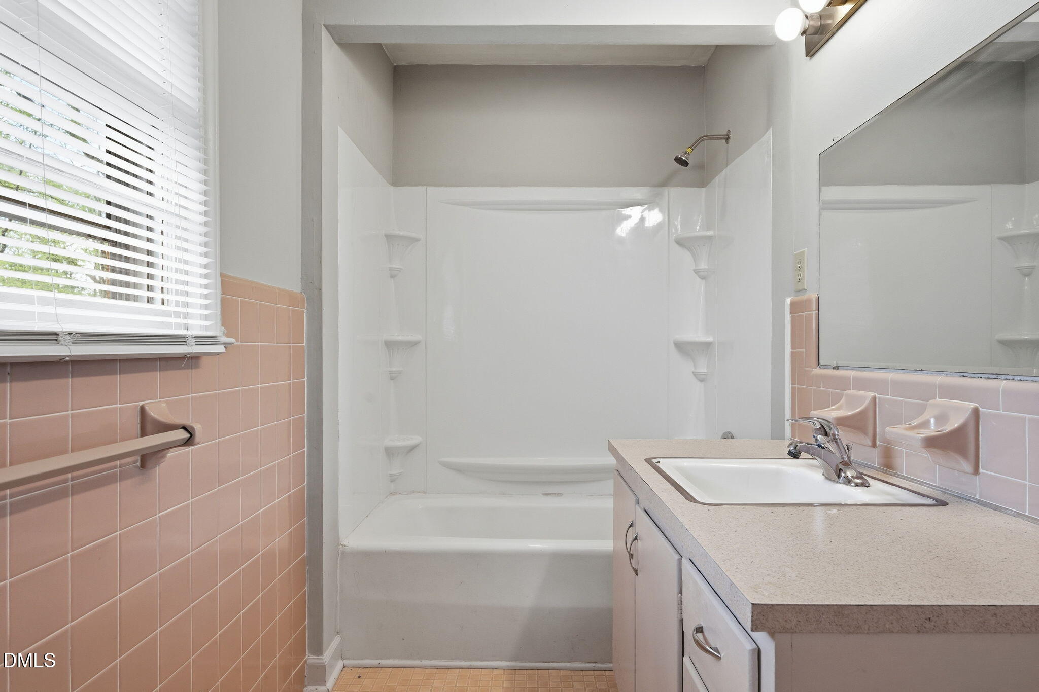 511 Hunter Street Durham, NC 27712 - Photo 21 of 30 a bathroom with a sink and a mirror